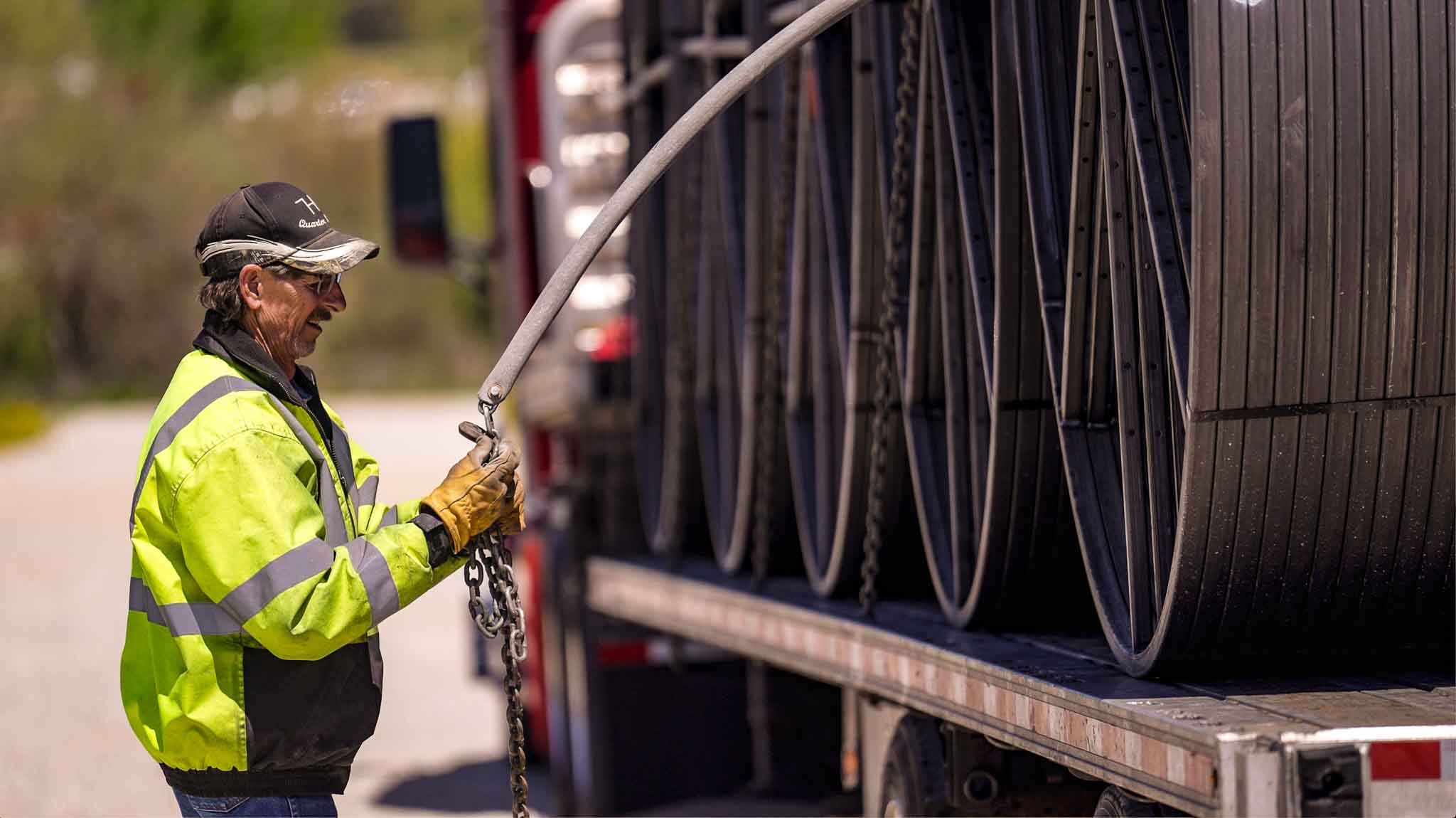 securing the steel reels on our L&R Transport Peterbilt trucks